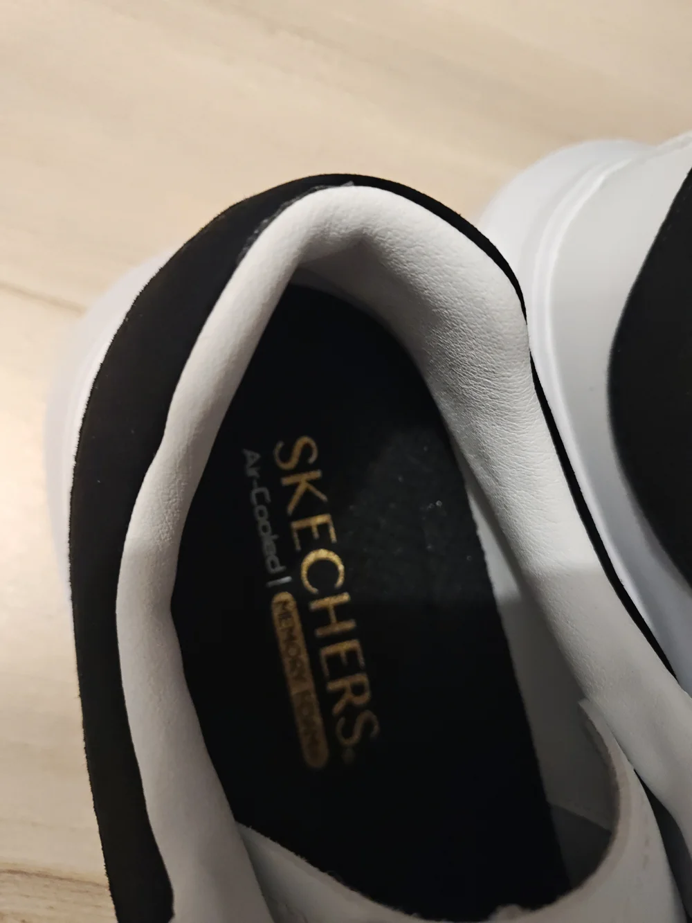 Skechers Men’s White Sneakers with Black Heel Accent 9